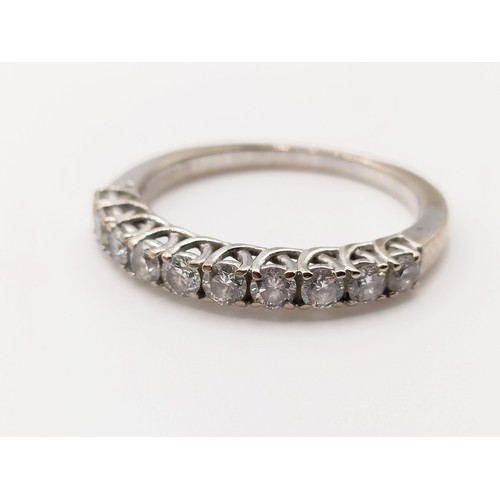 664 - An 18ct white gold and diamond half eternity ring, ring size K