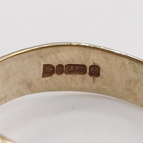 685 - A 9ct gold and garnet double snake ring, ring size V