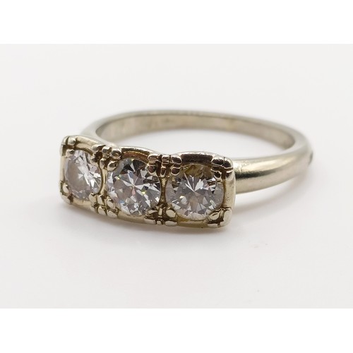 663 - A 14ct gold and diamond three stone ring, ring size J