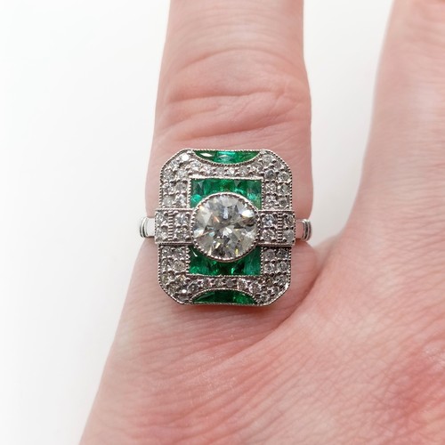 686 - An Art Deco style diamond and emerald target ring, central diamond 1ct approx., ring size N