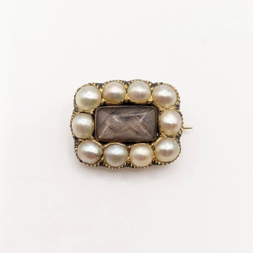 704 - A 19th century yellow coloured metal and cultured pearl memorial brooch, dated 1835