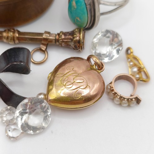 705 - A heart shaped locket, two pendants, a gilt metal pencil, and assorted costume jewellery