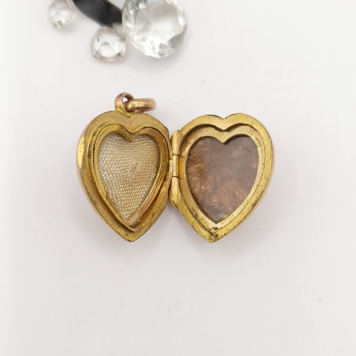 705 - A heart shaped locket, two pendants, a gilt metal pencil, and assorted costume jewellery
