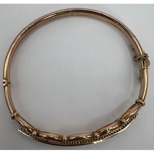 706 - A 9ct gold, sapphire and diamond bangle, 9.3 g, 7 cm diameter