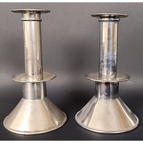 6 - A pair of George V silver candlesticks, on conical bases, London 1917, filled, 14 cm high (2)