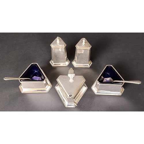 29 - A George V silver five piece Art Deco cruet, comprising two pepper pots, two triangular salts, and a... 