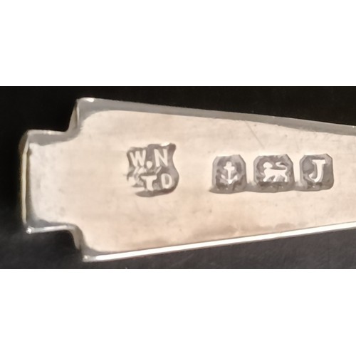 29 - A George V silver five piece Art Deco cruet, comprising two pepper pots, two triangular salts, and a... 