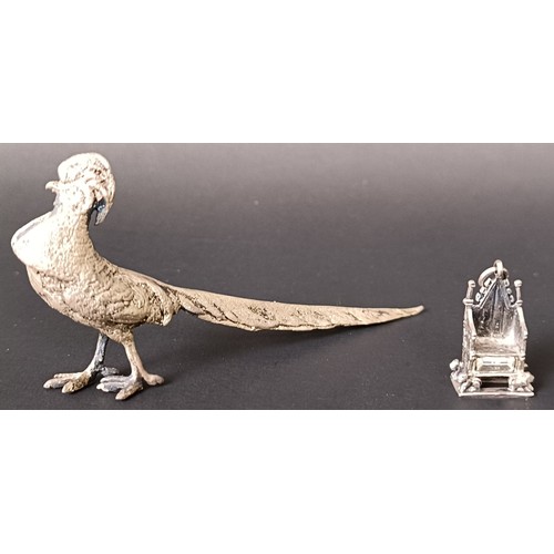 44 - A silver figure of a cockerel, Birmingham 1956, 0.9 ozt, and a miniature silver charm, in the form o... 