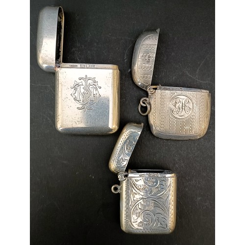 60 - A George V silver vesta, London 1922, and two other vestas, 2.9 ozt (3)