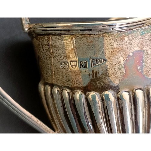 7 - A George V silver cream jug, 12 cm wide, and a pair of silver pin dishes, 4.3 ozt (3)