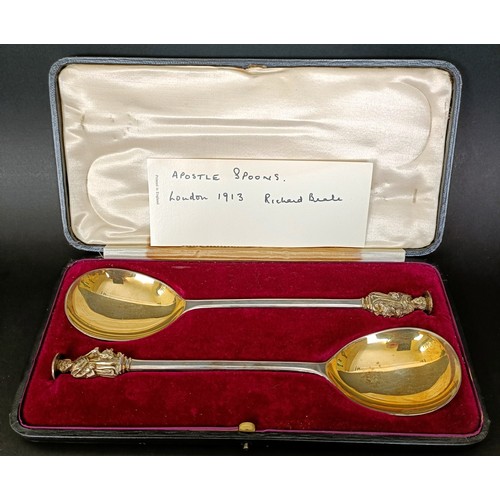 12 - A pair of George V silver gilt seal top spoons, London 1913, 4.6 ozt, cased