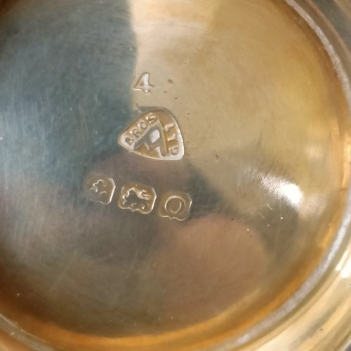 13 - A George VI silver three piece cruet, with blue glass liners, 2.7 ozt, cased