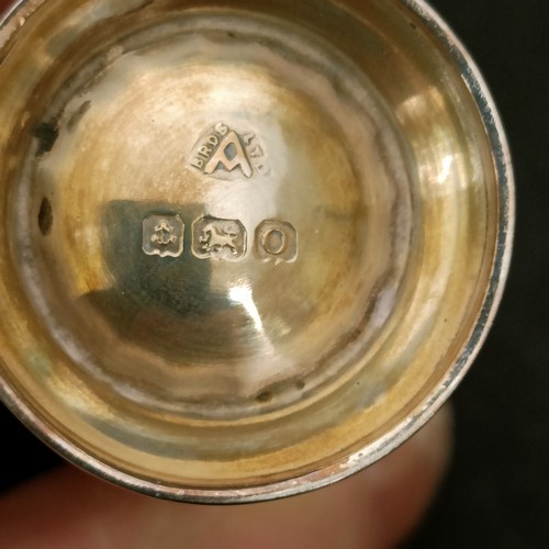 14 - A George VI silver three piece cruet, with blue glass liners, 2.7 ozt, cased