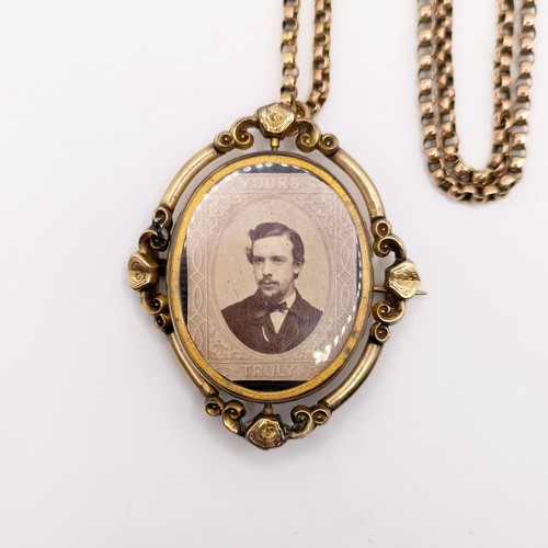 438 - A 19th century 9ct gold memorial locket, with a 19th century yellow coloured metal guard chai testin... 