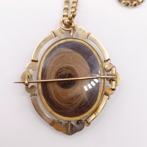 438 - A 19th century 9ct gold memorial locket, with a 19th century yellow coloured metal guard chai testin... 