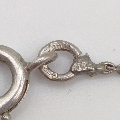 439 - An Art Nouveau style pendant with diamonds in a pierced setting, on a later/associated chain