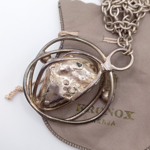 449 - A Kronox silver and uncut amethyst crystal pendant, on a chain, with a branded bag