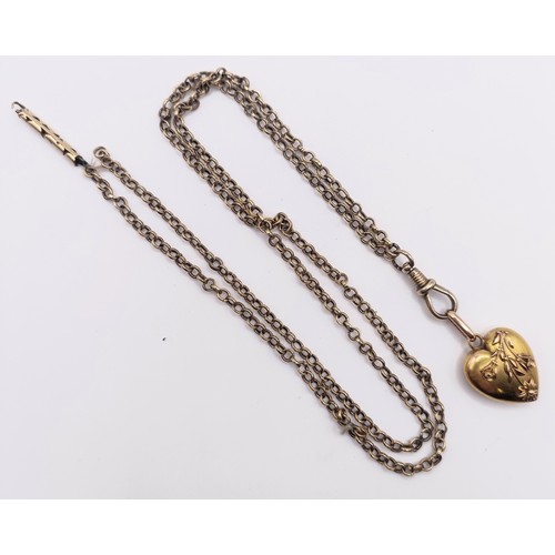 455 - A 15ct gold heart shaped locket, on a yellow coloured metal chain, 11.2 g all in
