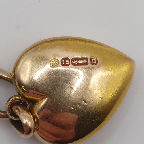 455 - A 15ct gold heart shaped locket, on a yellow coloured metal chain, 11.2 g all in