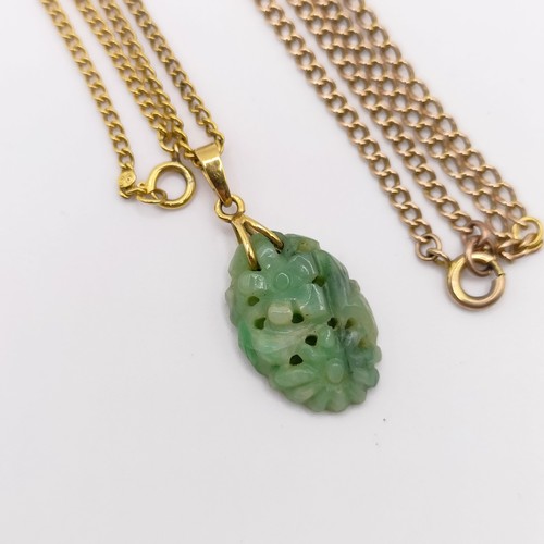 468 - A 9ct gold chain, 3 g, a green stone carved pendant, and a yellow coloured metal chain