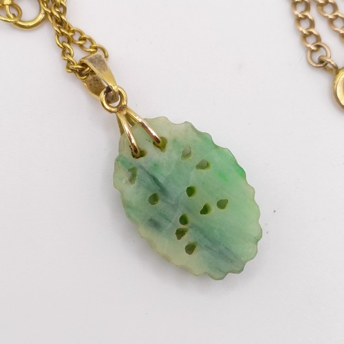 468 - A 9ct gold chain, 3 g, a green stone carved pendant, and a yellow coloured metal chain