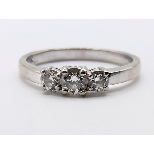 478 - An 18ct white gold and diamond three stone ring, ring size N