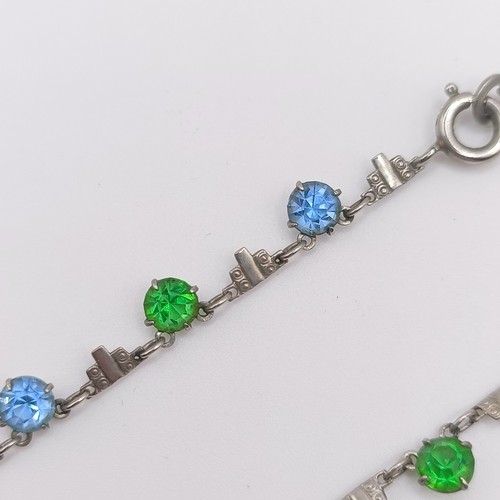 519 - An Art Deco silver coloured metal and paste bracelet, and a similar necklace