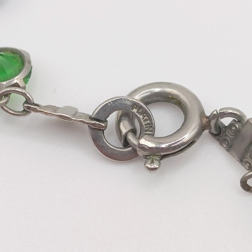 519 - An Art Deco silver coloured metal and paste bracelet, and a similar necklace