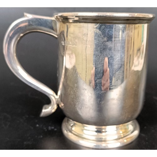 39 - A silver mug, inscribed to the base, Birmingham 1961, 8.4 ozt, 11 cm high