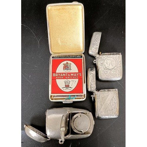 49 - A George V silver matchbox holder, two silver vestas, 2.4 ozt, and a silver plated vesta/sovereign h... 