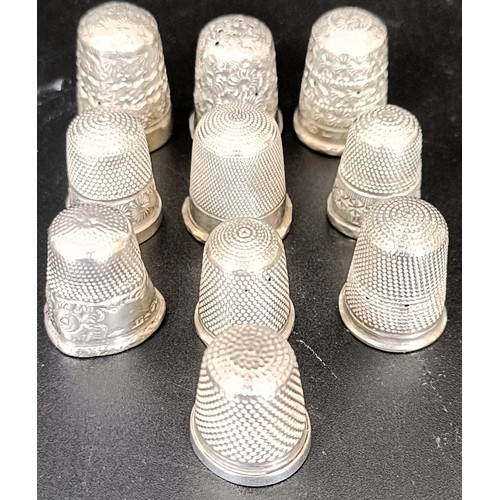 50 - Ten silver and silver coloured metal thimbles, 1.3 ozt all in