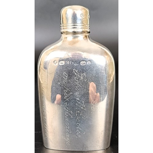 54 - A late Victorian small silver hip flask, engraved, Birmingham 1899, 2.1 ozt, 10 cm high