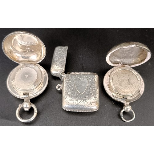 57 - Two silver sovereign holders and a silver vesta case (3)