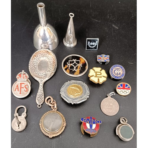 58 - A gilt metal compass charm, a silver and hardstone seal, a St Christopher, assorted badges and other... 