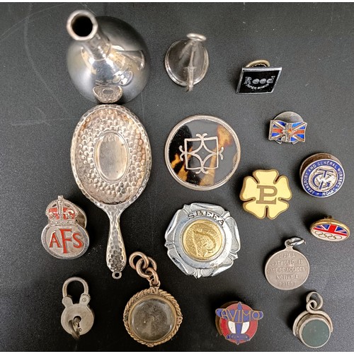 58 - A gilt metal compass charm, a silver and hardstone seal, a St Christopher, assorted badges and other... 