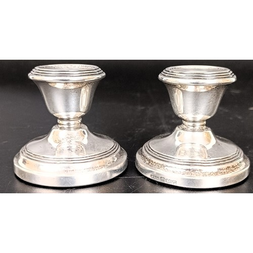 59 - A pair of silver dressing table candlesticks, 4 cm high
