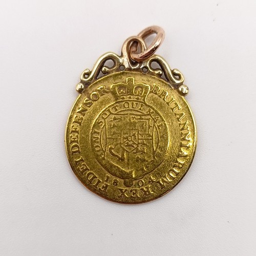 424 - A George III gold spade guinea, with a later mount, 4.7 g