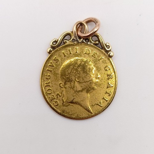 424 - A George III gold spade guinea, with a later mount, 4.7 g