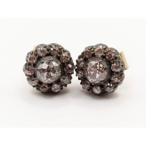 433 - A pair of early 20th century diamond stud earrings