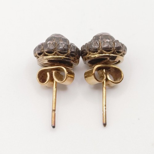 433 - A pair of early 20th century diamond stud earrings