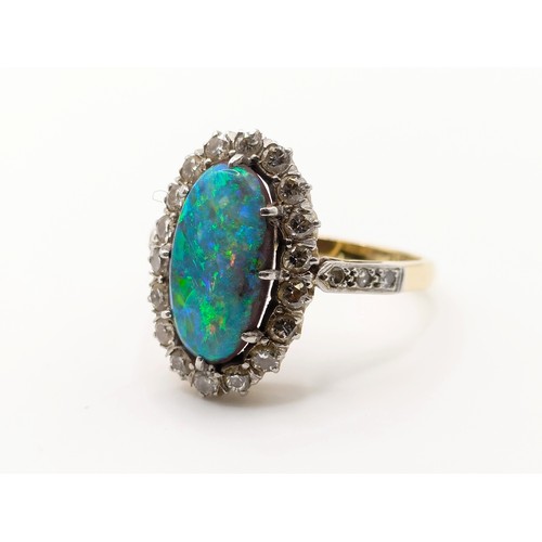 413 - An 18ct gold, diamond and opal doublet ringSize L