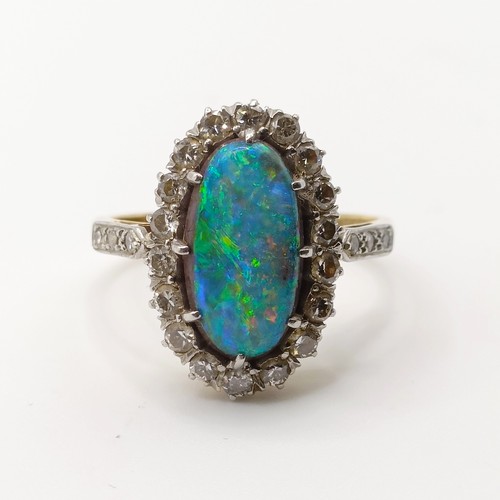 413 - An 18ct gold, diamond and opal doublet ringSize L