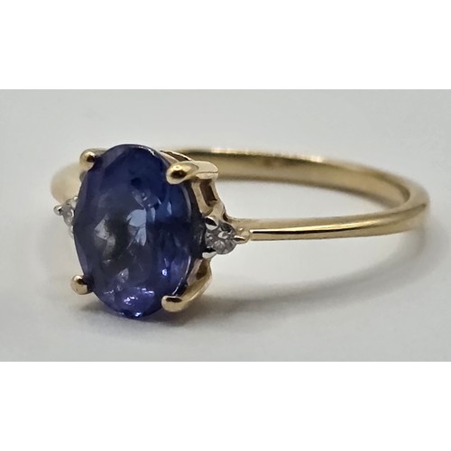 410 - A 9ct gold diamond and tanzanite ring, ring size L