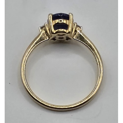 410 - A 9ct gold diamond and tanzanite ring, ring size L