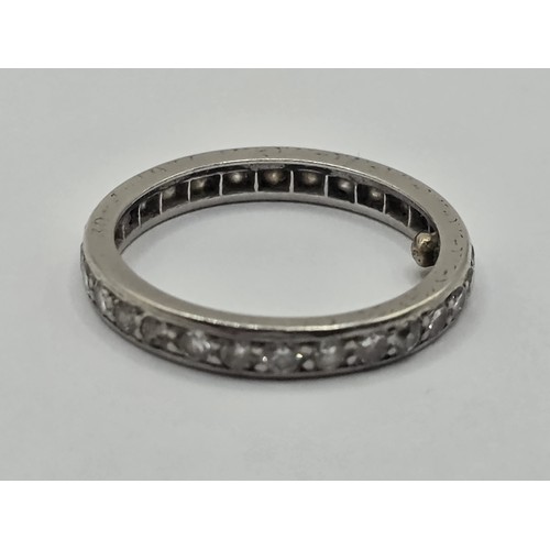 419 - A platinum and diamond full eternity ring, with spacers, ring size J