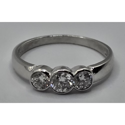 421 - A 18ct white gold and three stone diamond ring, ring size N