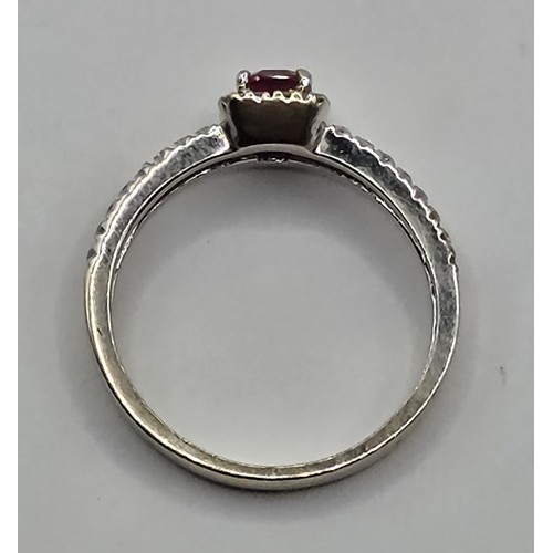 430 - An 18ct gold, ruby and diamond ring, ring size J