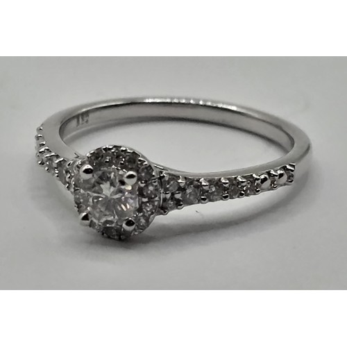 441 - An 18ct white gold and diamond halo ring, ring size J
