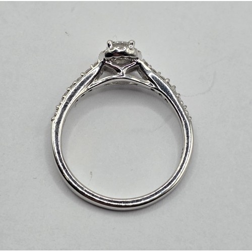 441 - An 18ct white gold and diamond halo ring, ring size J