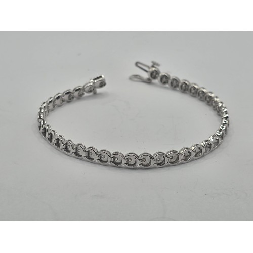 453 - An 19ct white gold and diamond bracelet, diamond weight approx. 1ct